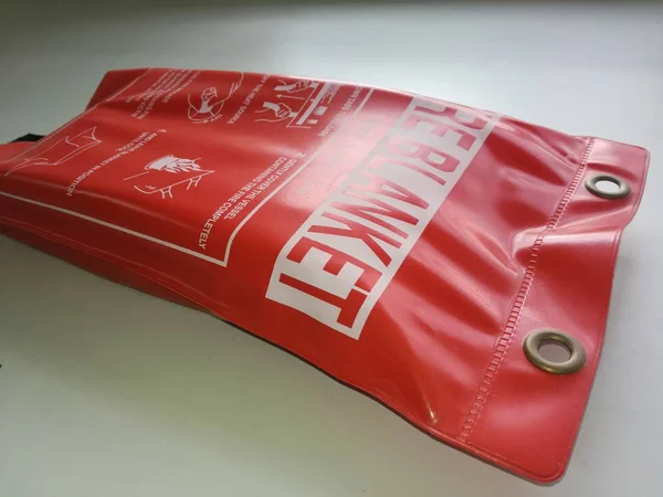 Close-up Fire blanket , used for extinguished flame and as a safety equipment .