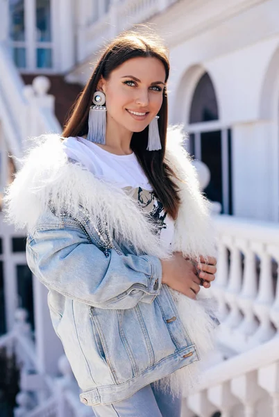 Beautiful sexy woman with dark hair in elegant jeans jacket and — Stock Photo, Image