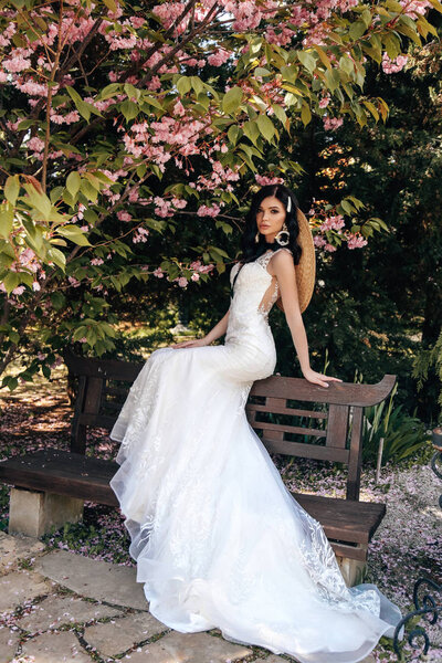 beautiful woman with dark hair in luxurious wedding dresses with