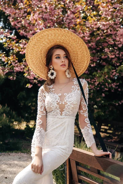 Beautiful woman with blond hair in luxurious wedding dresses wit — Stock Photo, Image