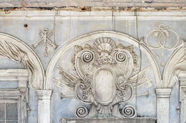 Coat of arms relief on facade of the Pidhirtsi Castle in Lviv Oblast in Ukraine