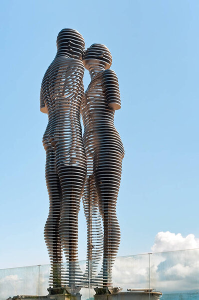 The moving metal love monument "Ali&Nino" in Batumi, Georgia. Figures are moving towards each other merging into a single entity, without touching.