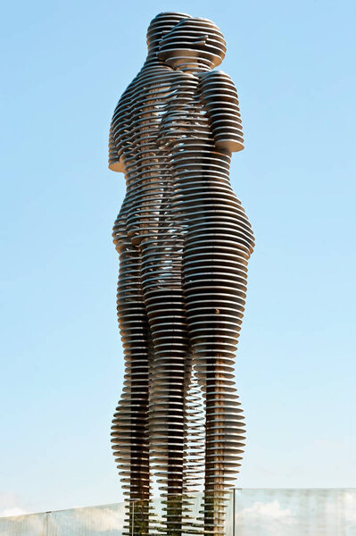 The moving metal love monument "Ali&Nino" in Batumi, Georgia. Figures are moving towards each other merging into a single entity, without touching.