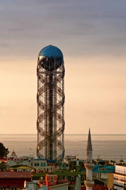 The silhouette of the Alphabetic Tower in Batumi, Georgia in evening