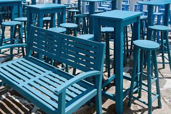 Stack of blue furniture on Naoussa street, Paros island Greece