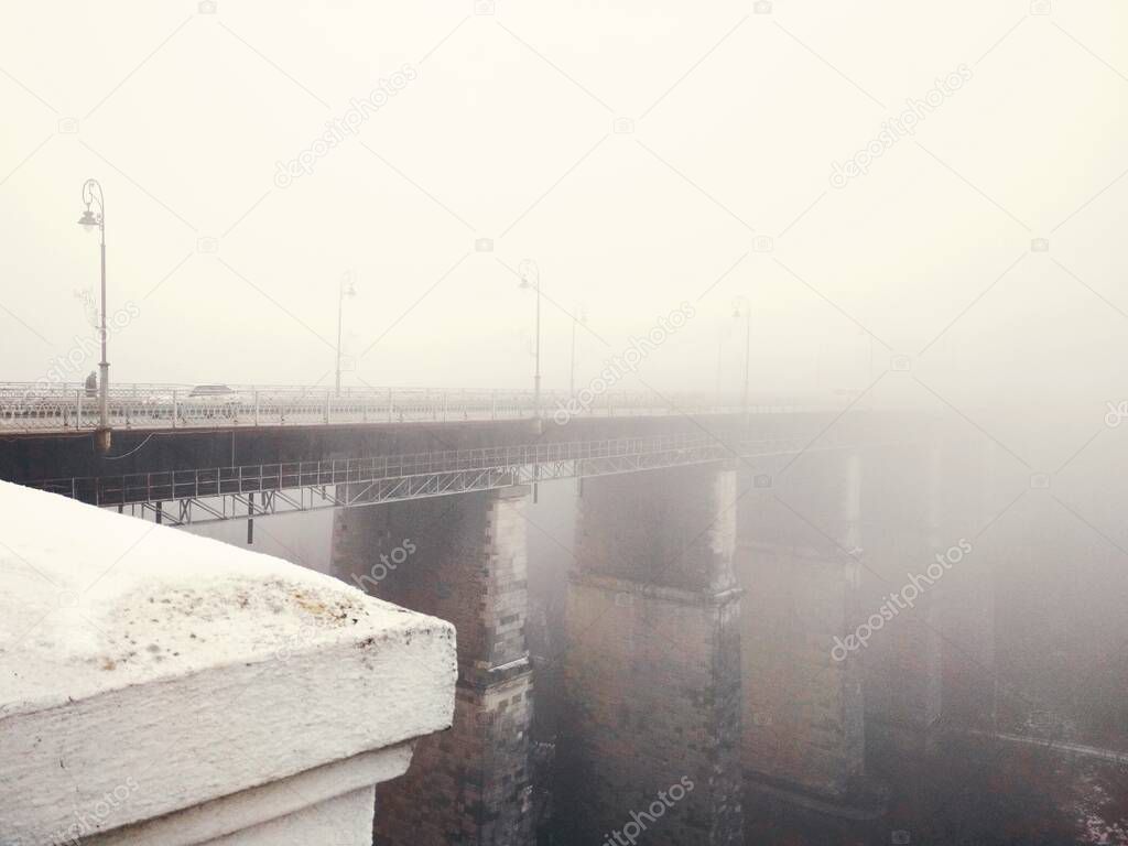 Bridge over canyon on a dull foggy winter day, Kamenets-Podolsky, Ukraine 