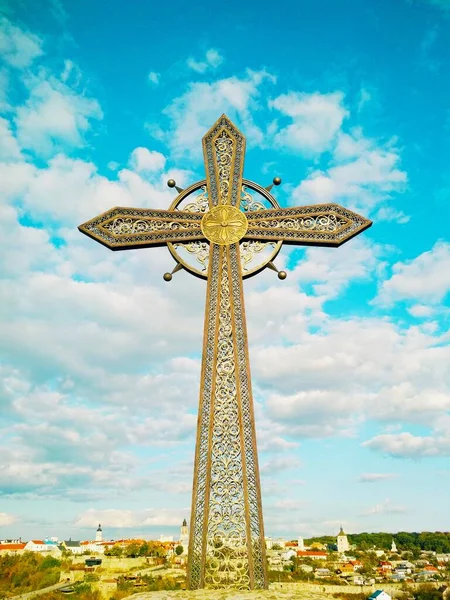 Orthodox cross against the background of the Old City, Kamenets-Podolsky, Ukraine