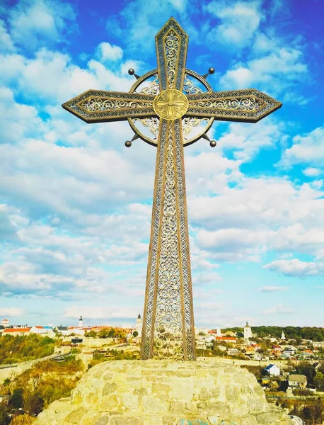Orthodox cross against the background of Old City, Kamenets-Podolsky, Ukraine