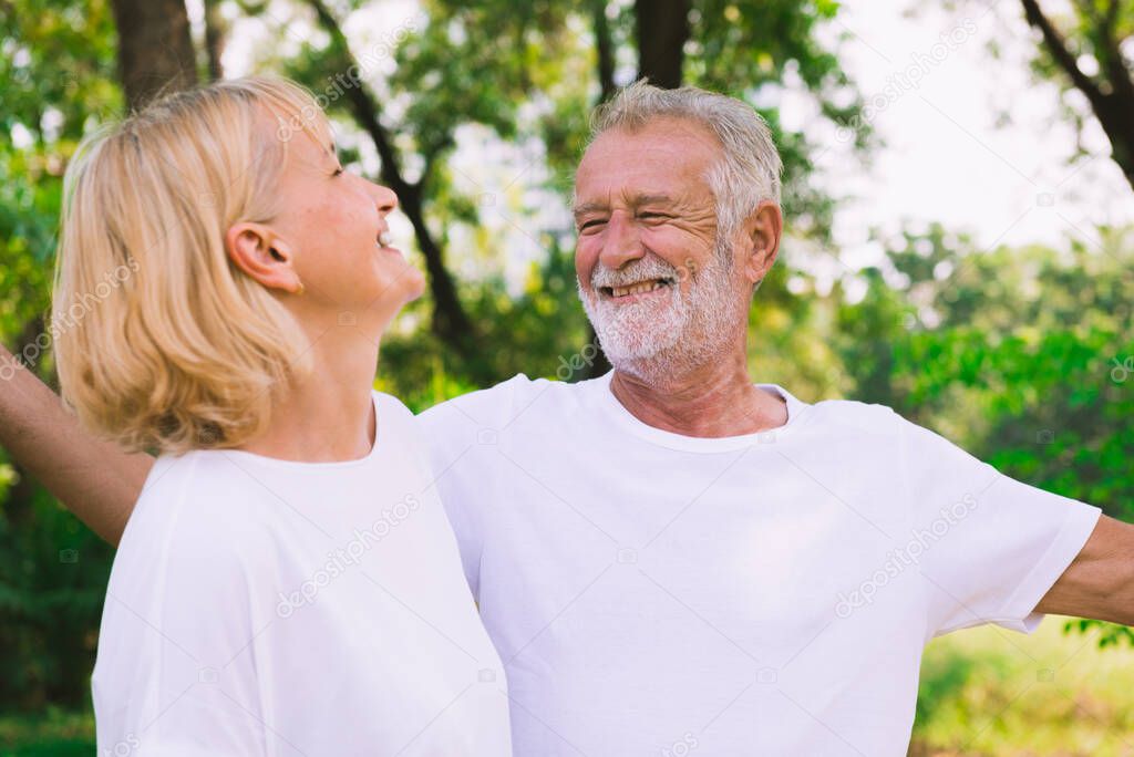 Mature couple relax together in the park