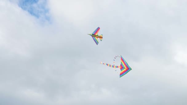 Two kites flying in cloudy sky — Stock Video