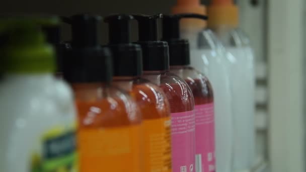 Woman buyng liquid soap in the supermarket — Stock Video