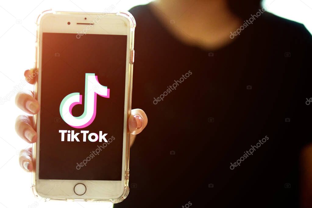 Nakhonratchasima, Thailand - May 31, 2020 : Tik Tok application information icon on Apple iPhone 8 close-up, which is a popular social media network is app to create and share videos on the internet.