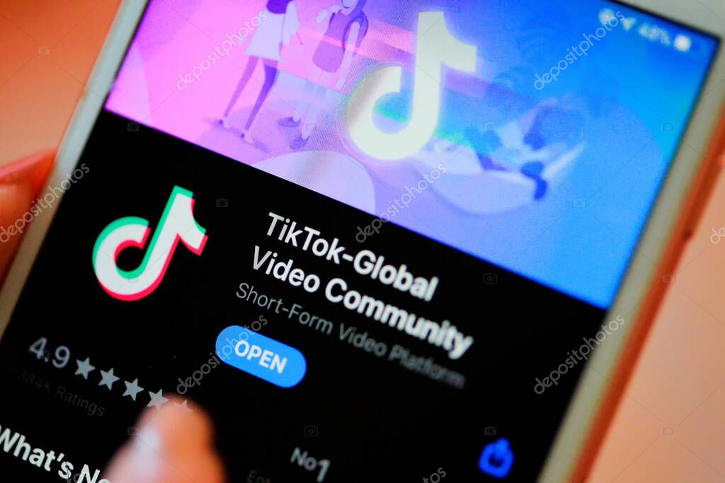 Nakhonratchasima, Thailand - May 31, 2020 : Tik Tok application information icon on Apple iPhone 8 close-up, which is a popular social media network is app to create and share videos on the internet.
