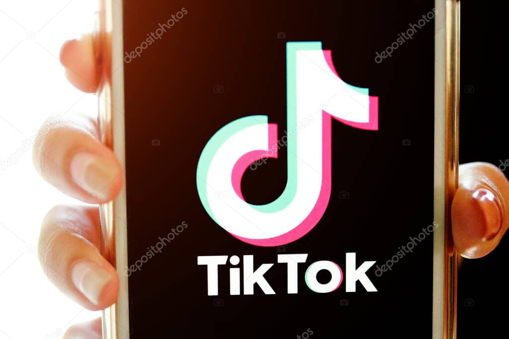 Nakhonratchasima, Thailand - May 31, 2020 : Tik Tok application information icon on Apple iPhone 8 close-up, which is a popular social media network is app to create and share videos on the internet.