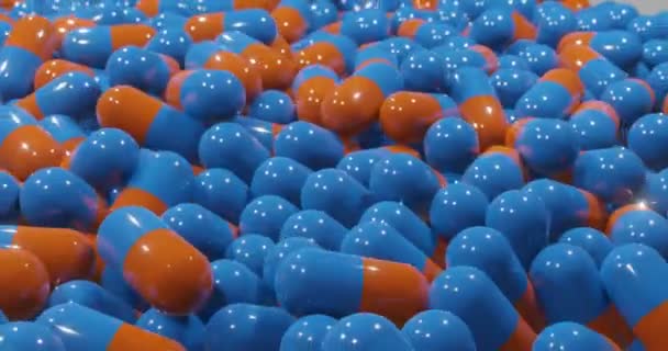 コロナウイルスCovid 19用の青とオレンジの錠剤カプセルの3Dレンダリングは マシンを回転させ 伝達しています ウイルスに感染した国や人々への配布や取引のために — ストック動画