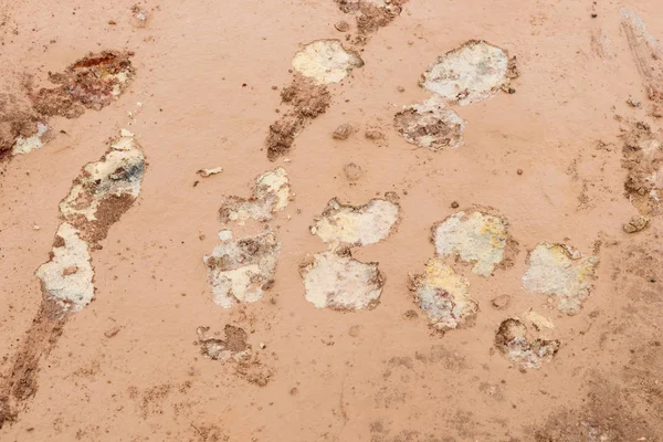 Mud ground with human footprints. Soil background