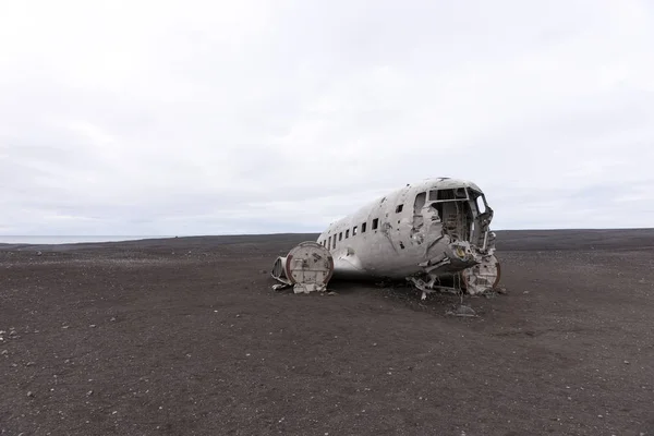 Plane wreck in iceland at a cloudy day with no people