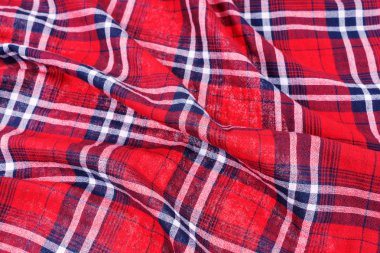 Kırışık madde. Kırmızı koyu mavi kareli gömlek giysi arkaplanı