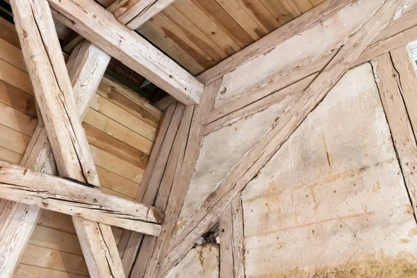 Wooden beams in the attic, wooden roof of an old building