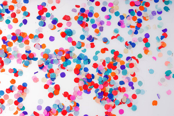 Colorful confetti on white background. Happy celebration party