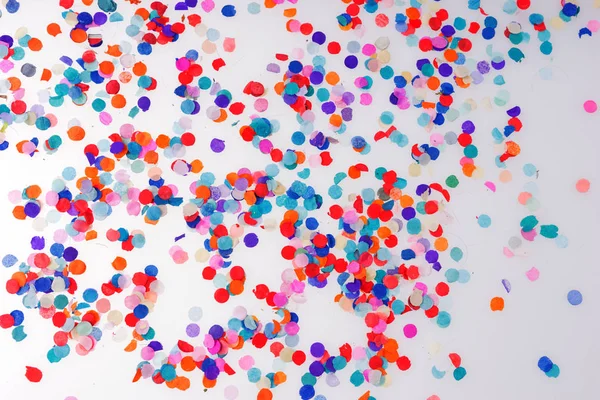 Colorful confetti on white background. Happy celebration party