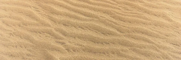 パノラマの砂の背景 風によって形成されたビーチの砂 — ストック写真