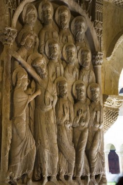 View of one of the eight reliefs that decorate the interior faces of the four pilasters that form the angles of the gallery of the monastery of Santo Domingo de Silos, Burgos (Spain). In this relief the descent of Jesus Christ is illustrated. clipart