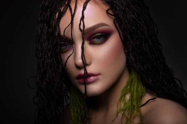 Woman with colorful make up and braids — Stock Photo, Image