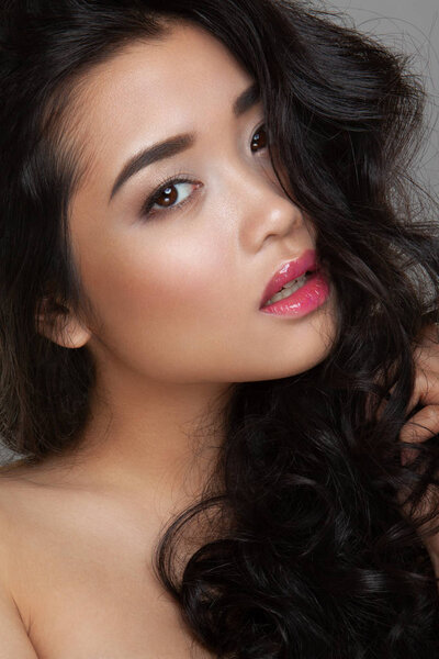 closeup young woman face with clean skin, pink lips