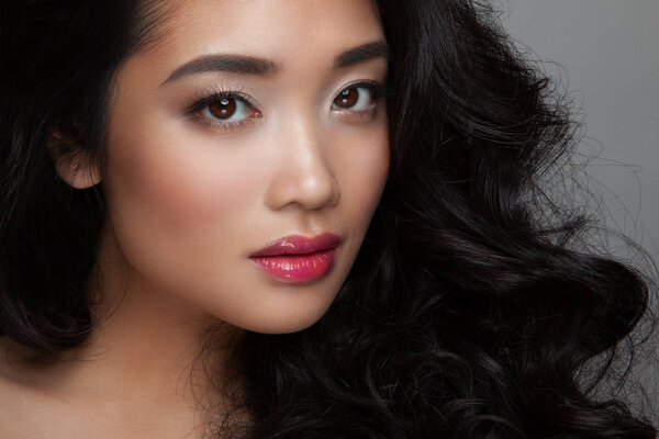 closeup young woman face with clean skin, pink lips
