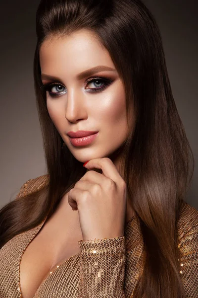 Beautiful woman with professional make up. Gold dress — Stock Photo, Image