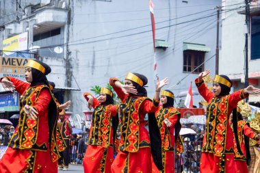 Moyo dance from Nias, North Sumatera. This dance symbolizes the movement of a flying eagle and the spirit of heroism and protection.