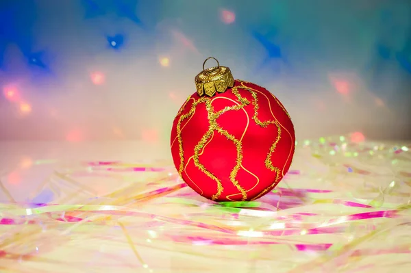 Red Christmas Ball Table Tinsel Background Lights — Stock Photo, Image