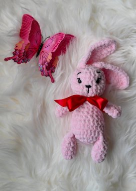 Real photograph of a handmade crocheted toy. Authentic and detailed craft item, suitable for themes such as handicrafts, creativity, childrens toys, sustainable lifestyle, and unique design.