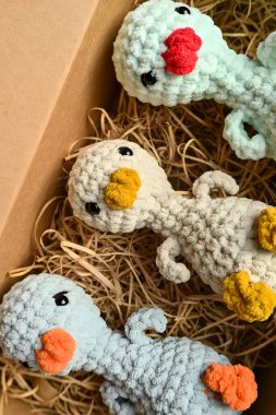 Real photograph of a handmade crocheted toy. Authentic and detailed craft item, suitable for themes such as handicrafts, creativity, childrens toys, sustainable lifestyle, and unique design.