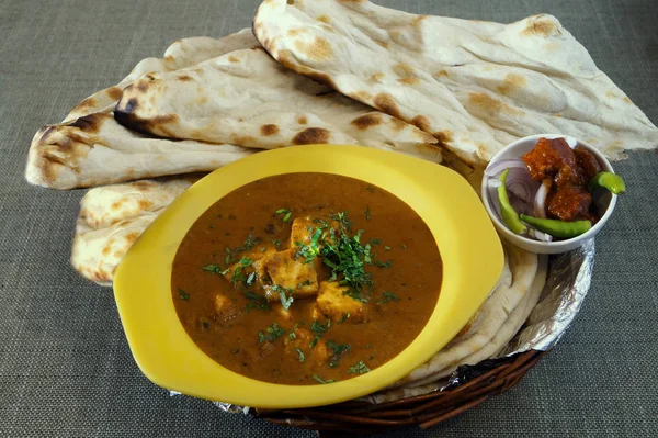 Indian curry cottage cheese curry with flat breads