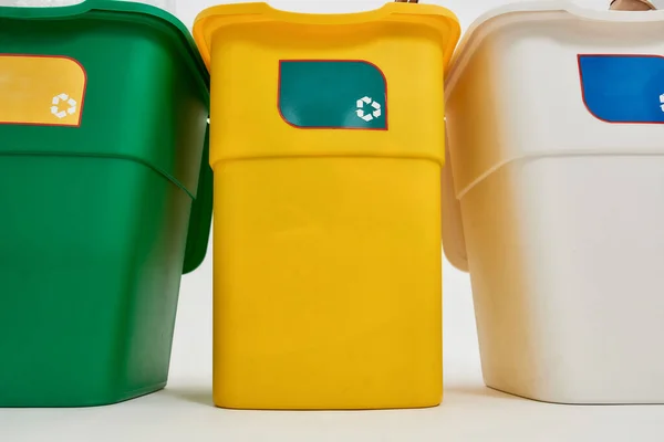 Set of three colorful green, yellow and white recycle garbage bins with recycle sign on it isolated on white background. Waste separation concept — Stock Photo, Image