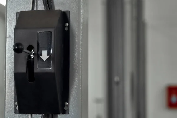 Close up of hoist up and down switch button in car garage. Car service, repair, maintenance concept — Stock Photo, Image