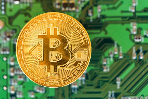 Golden brand new bitcoin on green digital background — Stock Photo, Image