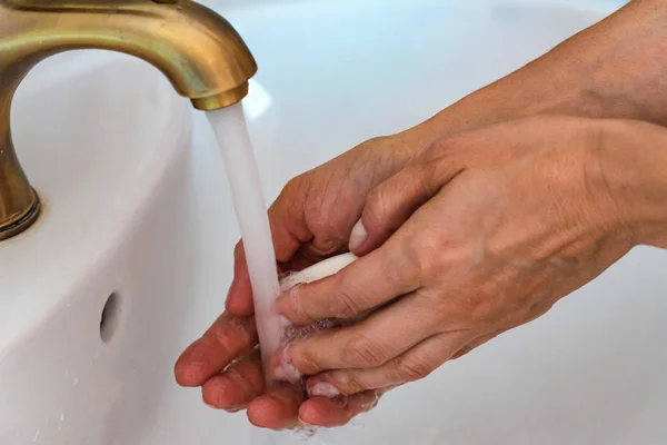 Close up woman washing her hands in sink — Stock Photo, Image