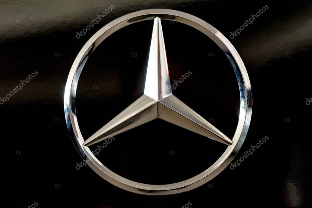 ROSTOV-ON-DON, RUSSIA - 27 OCTOBER 2018: Mercedes logo in brand showroom. Mercedes-Benz is a global automobile marque known for luxury vehicles, buses, coaches, and lorries.