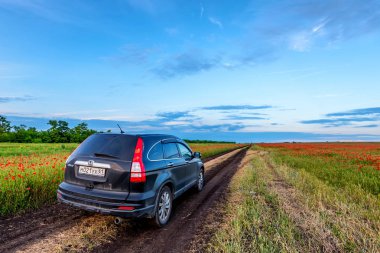 ROSTOV-ON-DON, RUSSIA - JUNE 21, 2017: Crossover parked in the coutry clipart