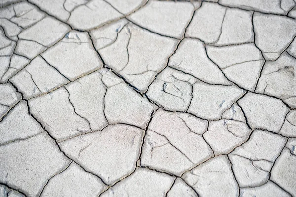 Trockene, schlammige Bodenoberfläche für die Hintergrundstruktur — Stockfoto
