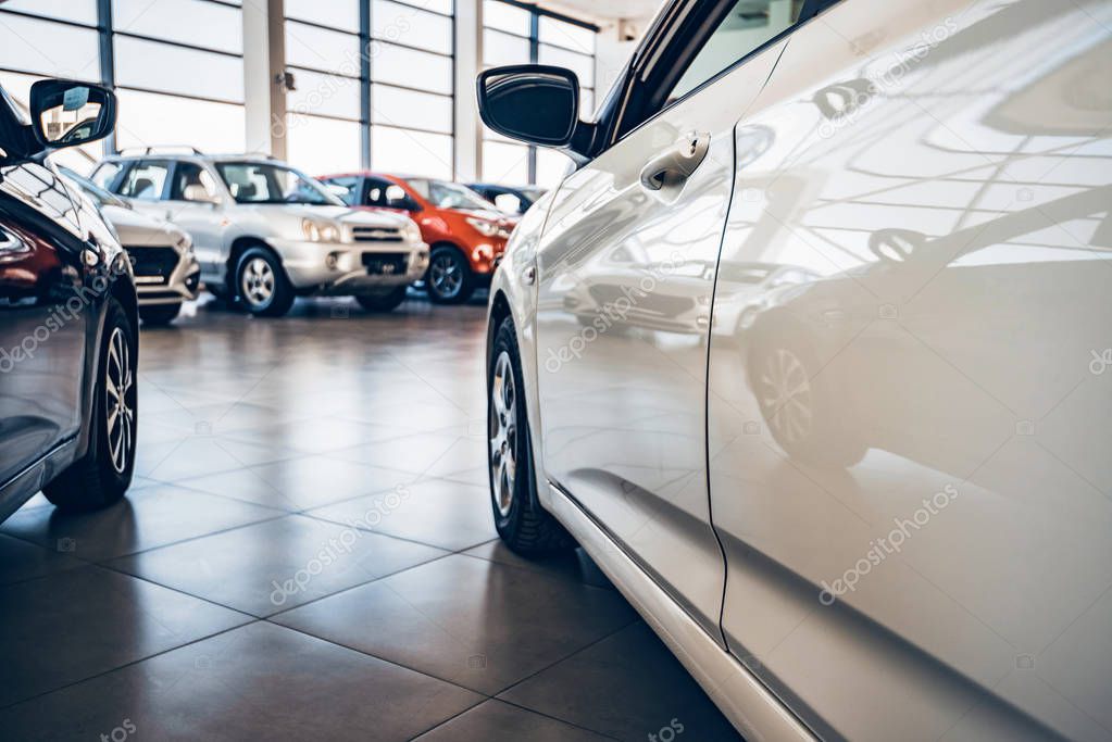 New cars at dealer showroom close view