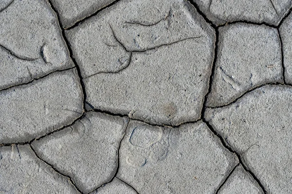 Trockene, schlammige Bodenoberfläche für die Hintergrundstruktur — Stockfoto