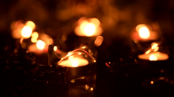 Holiday candles twinkle in an atmosphere of floating diffused lights — Stock Video