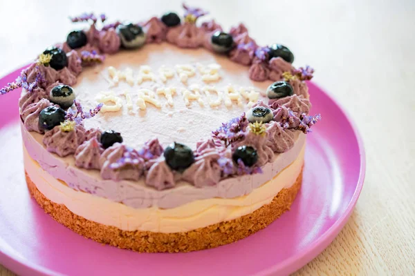 Close up birthday cake with cream and blueberries — Stock Photo, Image