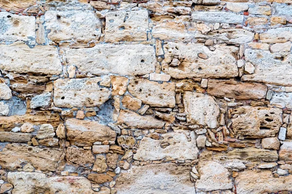 Cerca de viejo parcialmente destruido pared de piedra textura — Foto de Stock