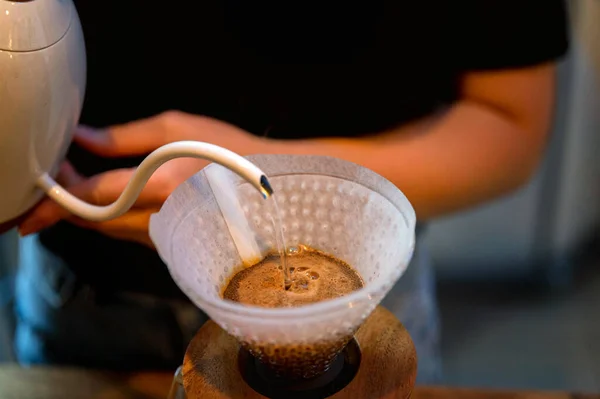 Close up of barista making brewed coffee with paper coffee filters — Stock Photo, Image