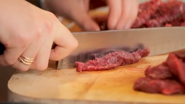 Slicing beef on a board — Stock Video